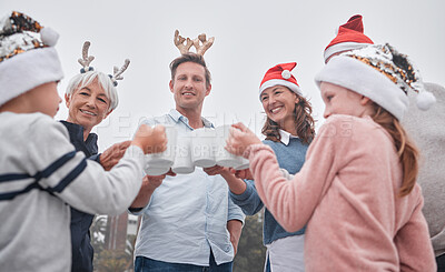Buy stock photo Christmas, celebrate and happy family on holiday travel vacation bonding together with drinks. Grandparents, parents and kid celebrating, quality time December festive drinking hot chocolate outdoors