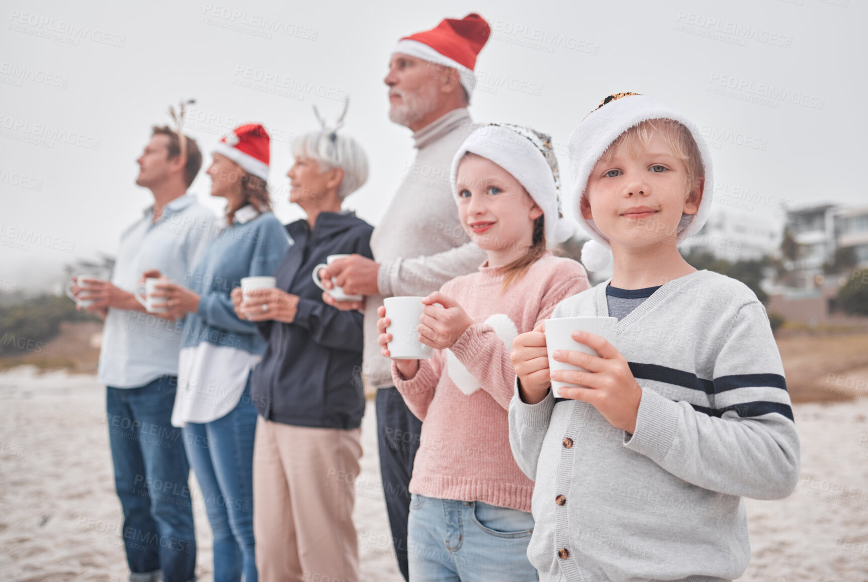 Buy stock photo Love, Christmas and freedom for happy family at the beach drinking eggnog, coffee or tea on big family vacation. Festive quality time for grandparents, parents and kids bonding on Amsterdam holiday