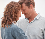 Happy couple, love and commitment while outdoor in nature sharing a romantic moment and smile. Safe, secure and happy man and woman showing appreciation, bond and connection in romance relationship