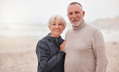 Buy stock photo Portrait of happy and senior couple couple enjoy a romantic date at the beach on a misty day. Love, happiness and elderly retired husband hug wife while seaside retirement vacation or travel holiday 