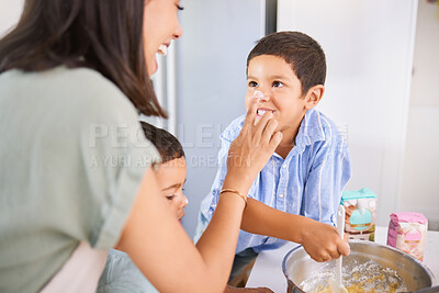 Buy stock photo Family, children and baking with a mother, son and brother learning about cooking in the kitchen together. Love, food and playful with a woman, boy and sibling in their home to bake or prepare a meal