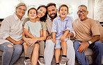 Big family, bonding and happy smile on a home living room sofa spending quality time together. Portrait of parents, elderly people and children with happiness smiling on a family home lounge couch 