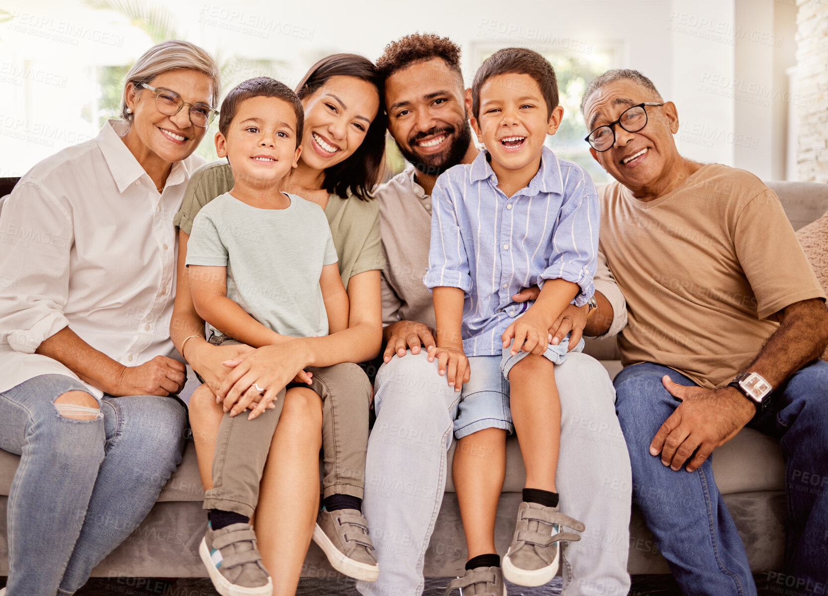Buy stock photo Happy, big family and smile on home living room sofa spending quality time bonding, love and relax together. Portrait of parents, grandparents and men and women with children smiling with happiness