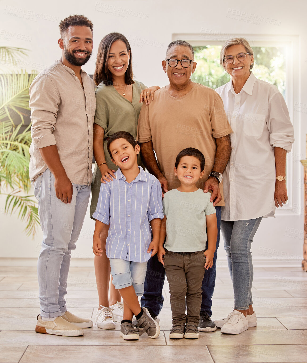 Buy stock photo Happy family portrait with kids, parents and grandparents with smile standing in brazil home. Happiness, family and generations of men, women and children spending time together making fun memories.