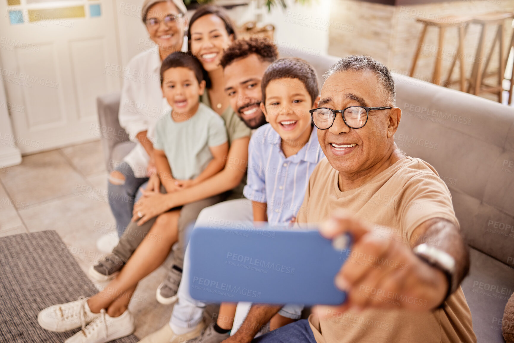 Buy stock photo Grandparents, children and phone selfie while bonding on sofa in house or home living room with social media technology. Smile, happy and mobile photography for kids, parents and seniors grandparents