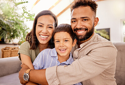 Buy stock photo Family, smile and love of child for his mom and dad while sitting together in the lounge at home sharing a special bond. Portrait of happy man, woman and boy kid smile and hug with parents in brazil