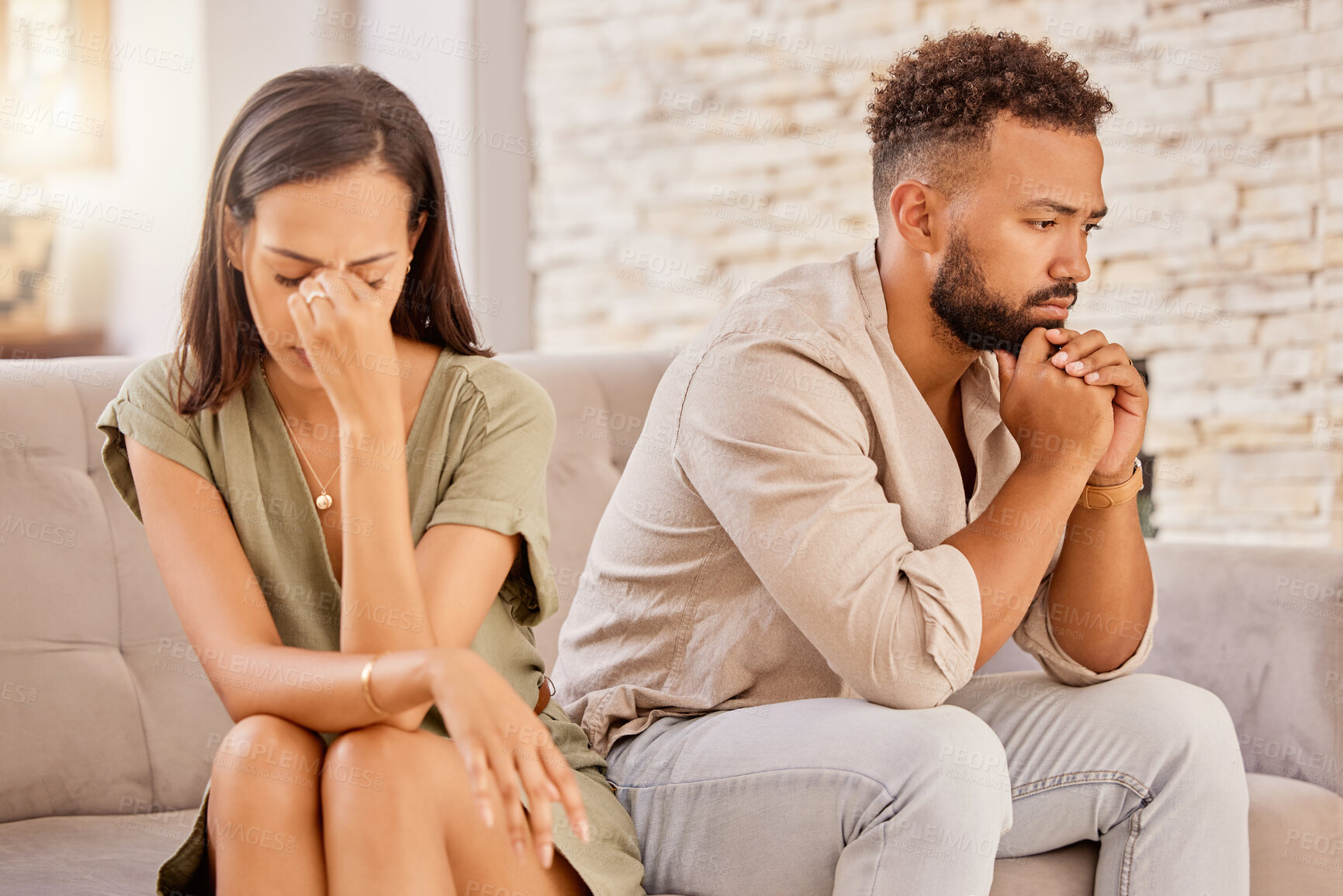 Buy stock photo Couple, divorce or stress on living room sofa in house, home or marriage counseling after fight, argument or affair. Sad, anxiety or depression for man or woman with mental health or breakup burnout