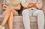 Couple, divorce and argument arms crossed on sofa in living room home. Fighting, depression and anxiety of angry man and woman, sad and annoyed after fight, toxic relationship and stress in house

