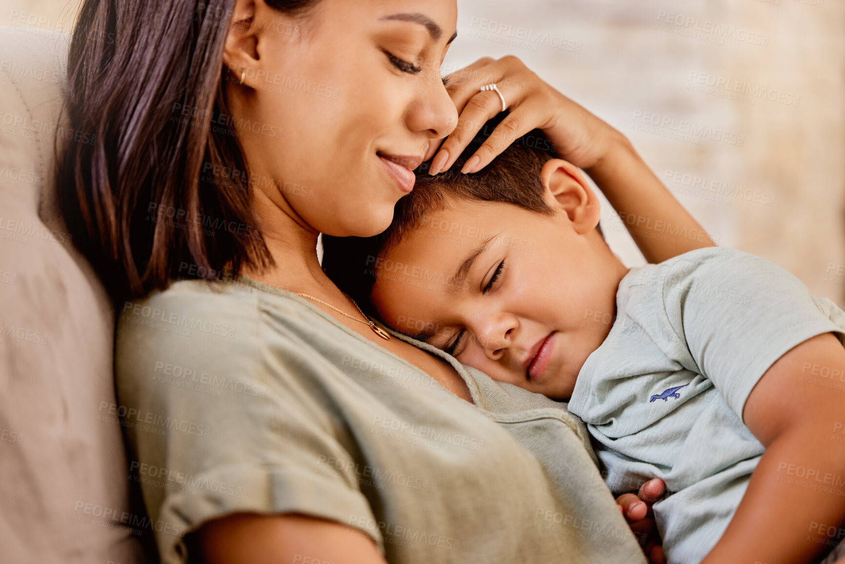 Buy stock photo Cuddle, mother and child with smile on the sofa in the living room for love, peace and relax together in their house. Happy, calm and mom with care and hug for a kid on the couch in their family home