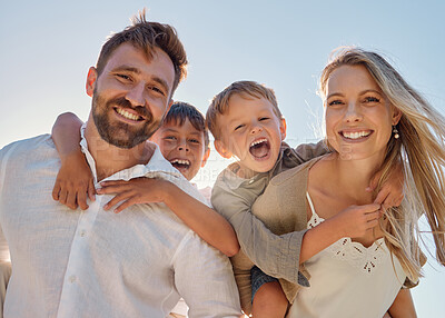 Buy stock photo Happy family, portrait and beach with happy, smile and relax mother and father hug, embrace and laughing together. Kids, face and parents on sea vacation with family bonding, excited and cheerful