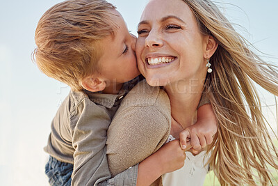 Buy stock photo Kiss, mother and child with smile in a park for relax, adventure and peace together in summer. Face of a happy, thinking and young mom with her kid kissing and hugging her in nature with a piggyback