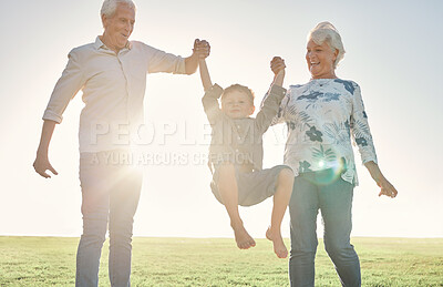 Buy stock photo Family, holding hands and grandparents with boy in park, nature or outdoors. Love, support and happy man and woman lift child, kid and having fun time, care or bonding with smile together in sunshine