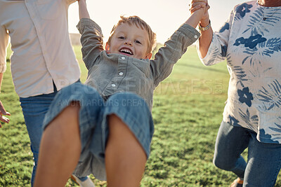 Buy stock photo Happy, grass and child holding hands with parents on nature walk in a field on a summer holiday. Family, support and love, happiness in fun quality time with young boy walking and playing on vacation