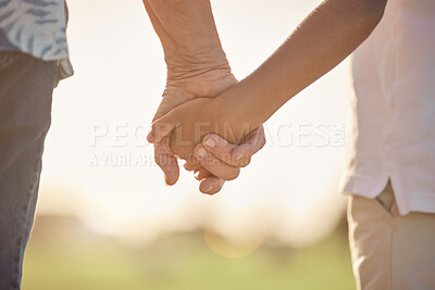 Buy stock photo Love, care and couple holding hands in a park for support, help and hope together during summer. Back of man and woman with kindness, trust and gratitude in their marriage while in a field in nature