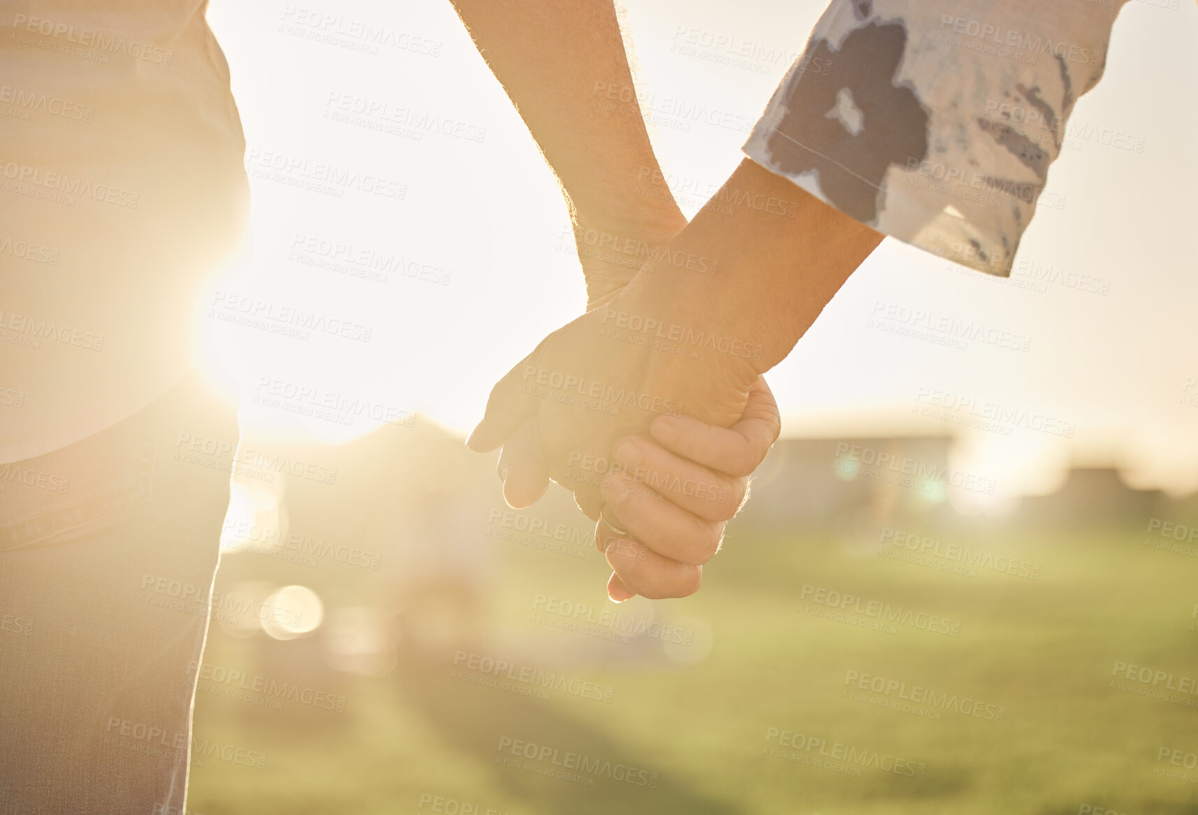 Buy stock photo Retirement, couple and hands with sun closeup of married man and woman on field for summer walk. Support, care and trust of senior people in marriage walking in sunlight for romantic evening.