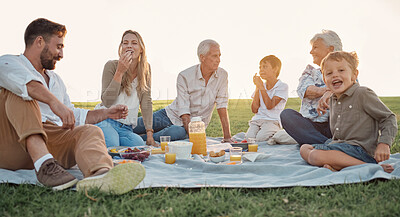 Buy stock photo Love, picnic and family happiness with people smile and relax at a park or field, bonding and having fun. Happy kids enjoy weekend holiday with grandparents and parents, love and food in Germany