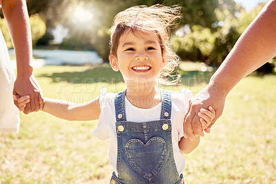 Buy stock photo Happy, child in sun and walk with parents in nature park with a smile holding girl hands in summer sunshine. Kid in garden, smiling on grass and family relax enjoy weekend childhood outdoor freedom 
