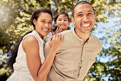 Buy stock photo Family, couple and child being happy, smile and relax for fun, vacation and joy together outdoor. Portrait, man and woman with kid have quality time, bonding and embrace being playful and cheerful.