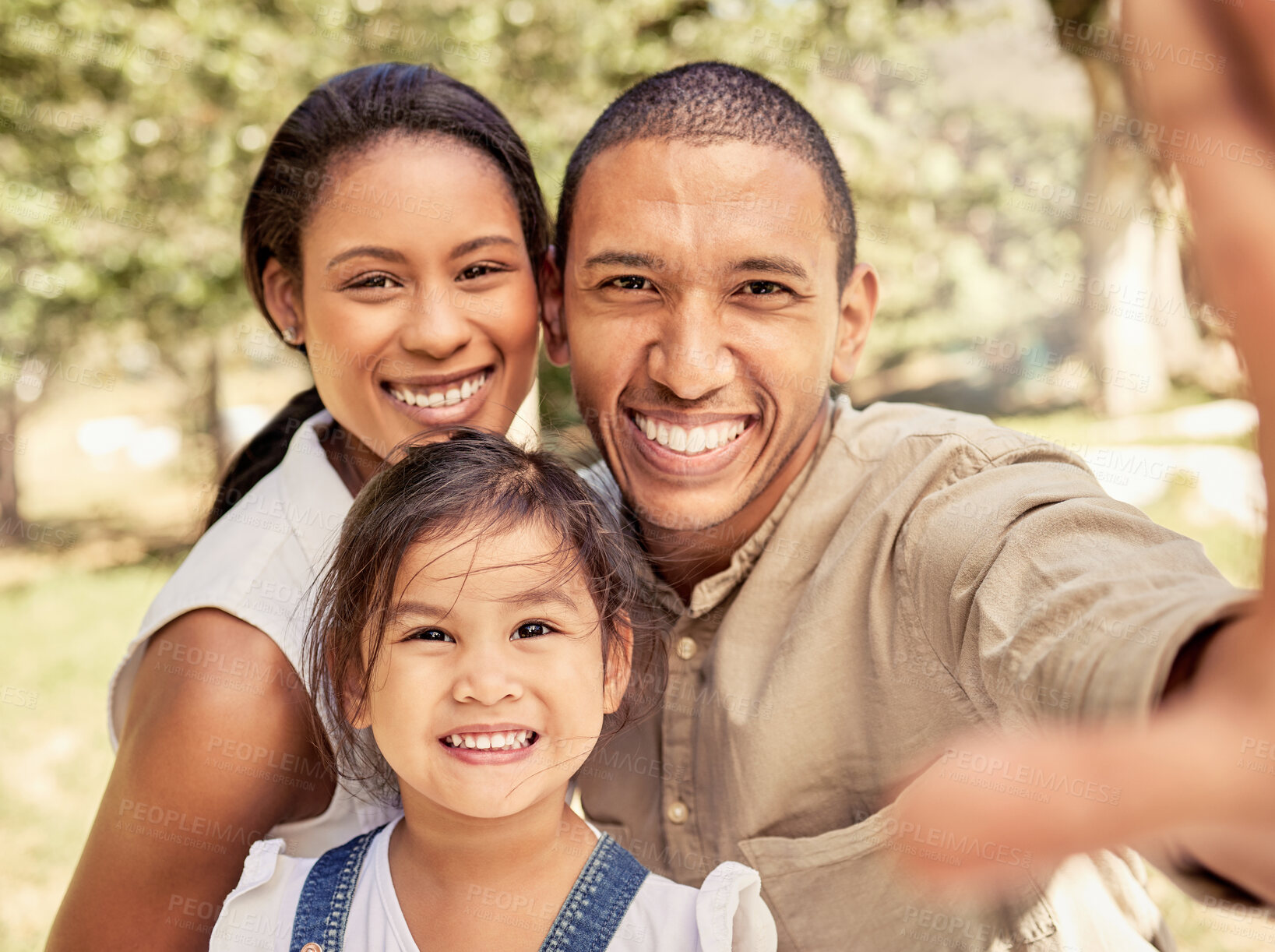 Buy stock photo Selfie, family and park with a black couple and foster asian girl child posing for a photograph together outdoor. Children, picture and summer with adopted parents and their daughter bonding outside