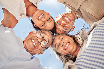 Buy stock photo Portrait, huddle and family with smile for support, love and solidarity from below with blue sky. Face of happy, relax and comic children with senior parents for community and happiness in summer