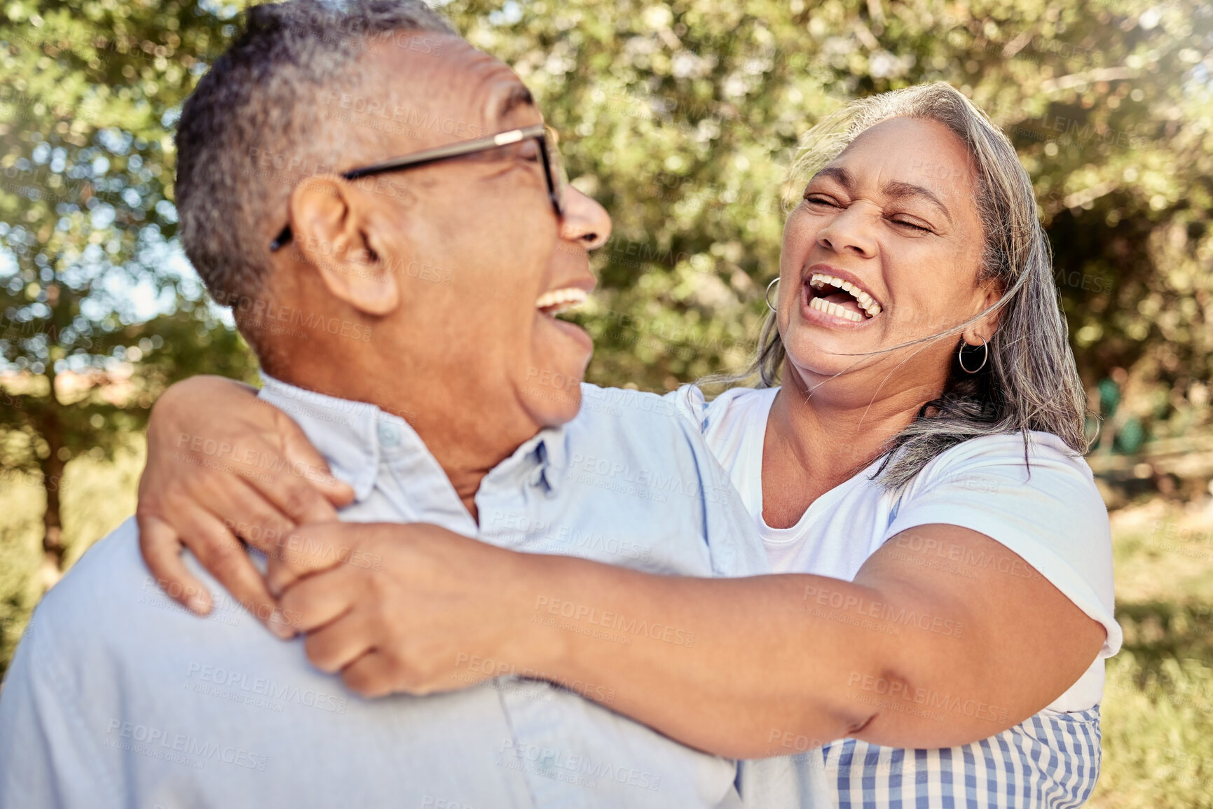 Buy stock photo Happy, love and laugh with a senior couple having fun in a garden or park together during summer. Trees, smile and retirement with an elderly man and woman pensioner bonding while enjoying nature