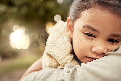 Buy stock photo Sad, child and mother with a hug in a park, garden or nature with love together. Care, relax and face of a young girl with support and comfort while hugging her mom with affection by a field