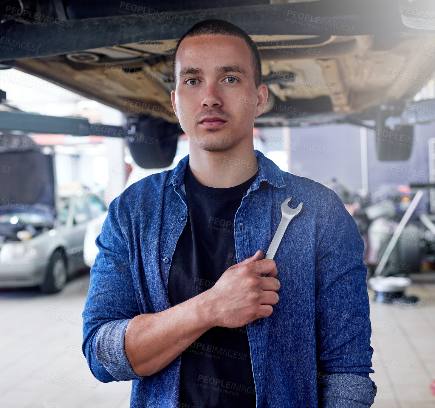 Buy stock photo Man, mechanic and tool in engineering for auto repairs, handyman or service at the workplace. Portrait of professional mechanical employee for vehicle fixing, problem solving or maintenance in garage