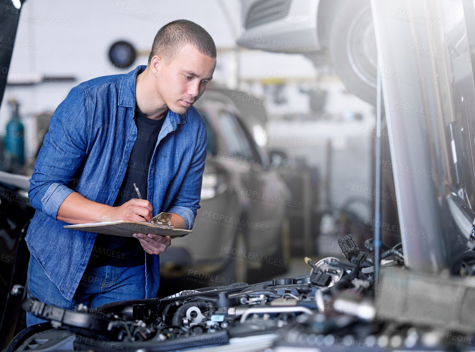 Buy stock photo Car service, inspection and mechanic by car with clipboard checking engine. Technician, engineer and man working in garage or workshop writing notes for repair, maintenance and motor care for vehicle