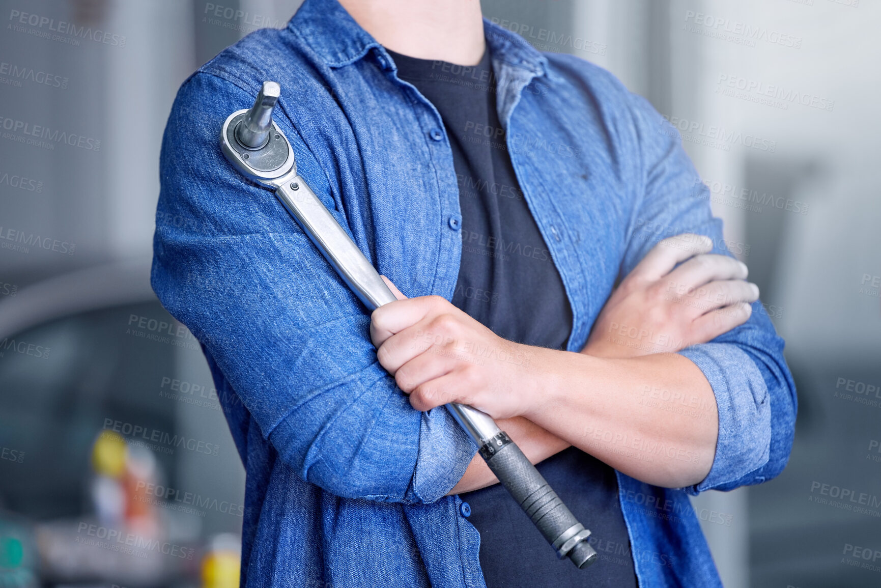 Buy stock photo Mechanic with socket wrench, car maintenance and man in workshop for auto repair and mechanical engineering. Automobile technician arms, transportation engineer and tool, working and f1 industry.