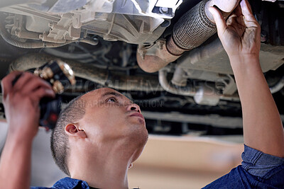 Buy stock photo Car, mechanic in garage and service inspection of motor vehicle for maintenance or safety. Auto shop, automobile workshop engineer and repairman working with torch to check vehicle pipe for oil leak 