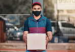 Delivery man, box and covid face mask working for courier service with package, shipment or parcel outdoor. Express, logistics and portrait of guy ready to deliver ecommerce order during coronavirus