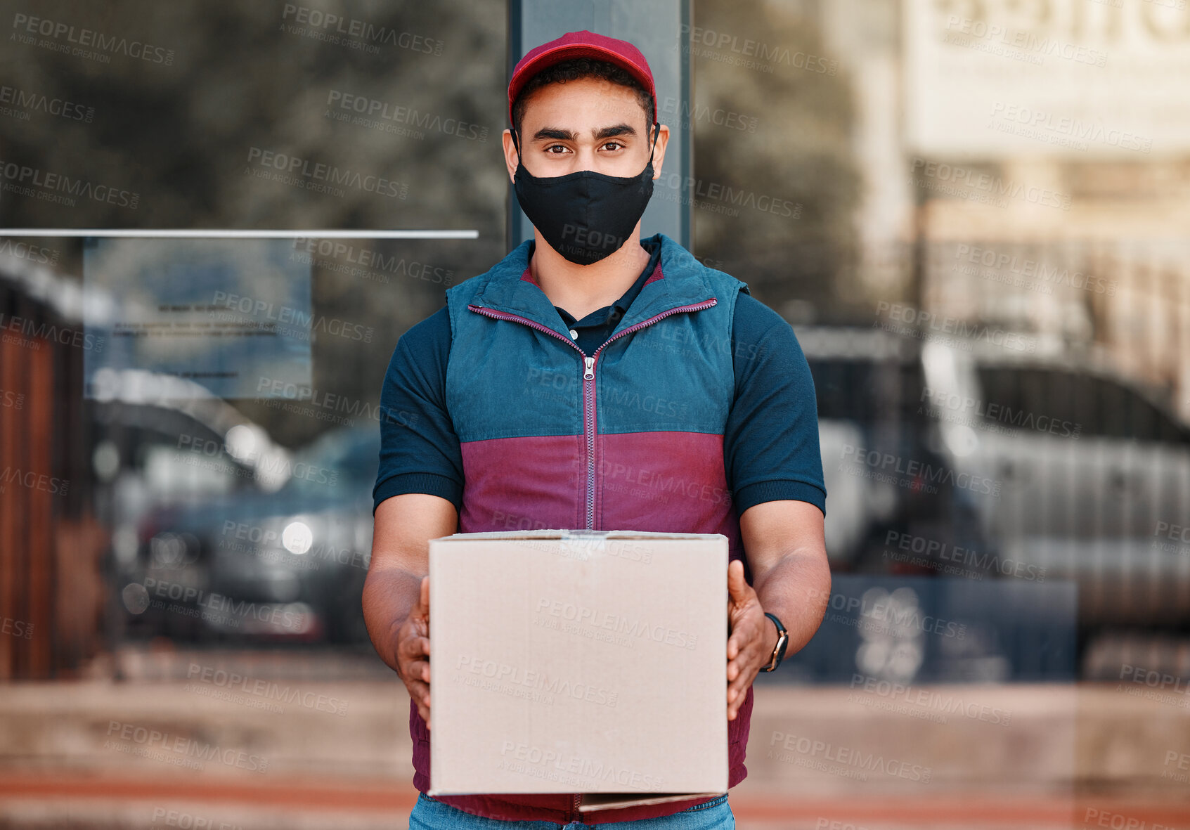 Buy stock photo Delivery man, box and covid face mask working for courier service with package, shipment or parcel outdoor. Express, logistics and portrait of guy ready to deliver ecommerce order during coronavirus