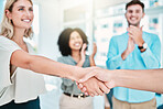 Business people, handshake and clapping for b2b partnership in success, vision and growth at the office. Hand of woman with smile shaking hands for company agreement, meeting or deal at the workplace