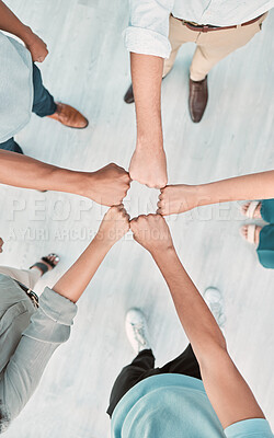 Buy stock photo Fist bump, team building and business people in collaboration for success, mission goals and company sales targets. Top view, support and startup workers meeting with trust, teamwork and our vision