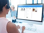 Call center, customer service and computer with a woman consultant working at her desk in a telemarketing office. Contact us, crm and information with a female consulting with a headset at work