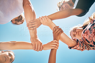 Buy stock photo Support, holding wrists and friends in a circle for collaboration, trust and teamwork outdoors. Diversity, love and people in a community with compassion, respect and unity with a sky blue background