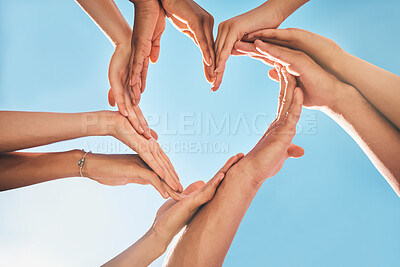 Buy stock photo Heart, love and group hands for support, care and community with outdoor summer sunshine, blue sky and mock up. Group of people with care sign for solidarity, health and wellness background mockup