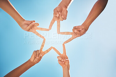 Buy stock photo Hands, star and teamwork with friends in a huddle on a clear blue sky background from below. Trust, support and community with a group of people making a hand sign shape outdoor together in the day