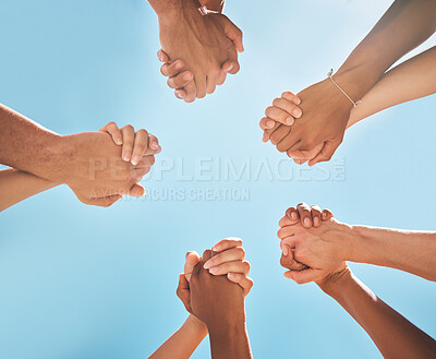 Buy stock photo Hands, solidarity and holding hands, support and collaboration, partnership and diversity with blue sky background. Teamwork, unity and group of people, team building and community with trust.