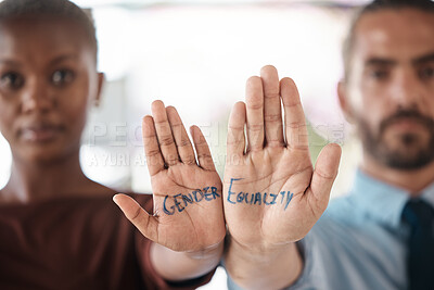 Buy stock photo Hands, gender equality and unity with a sign message on the hand of a business man and woman in the office. Team, diversity and empowerment with a male and female employee standing in solidarity