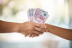 Hands, corruption and business people shaking hands with euros for bribe, illegal deals or loan. Cash, exchange or money laundering, agreement or deposit, financial payment or investment acceptance.