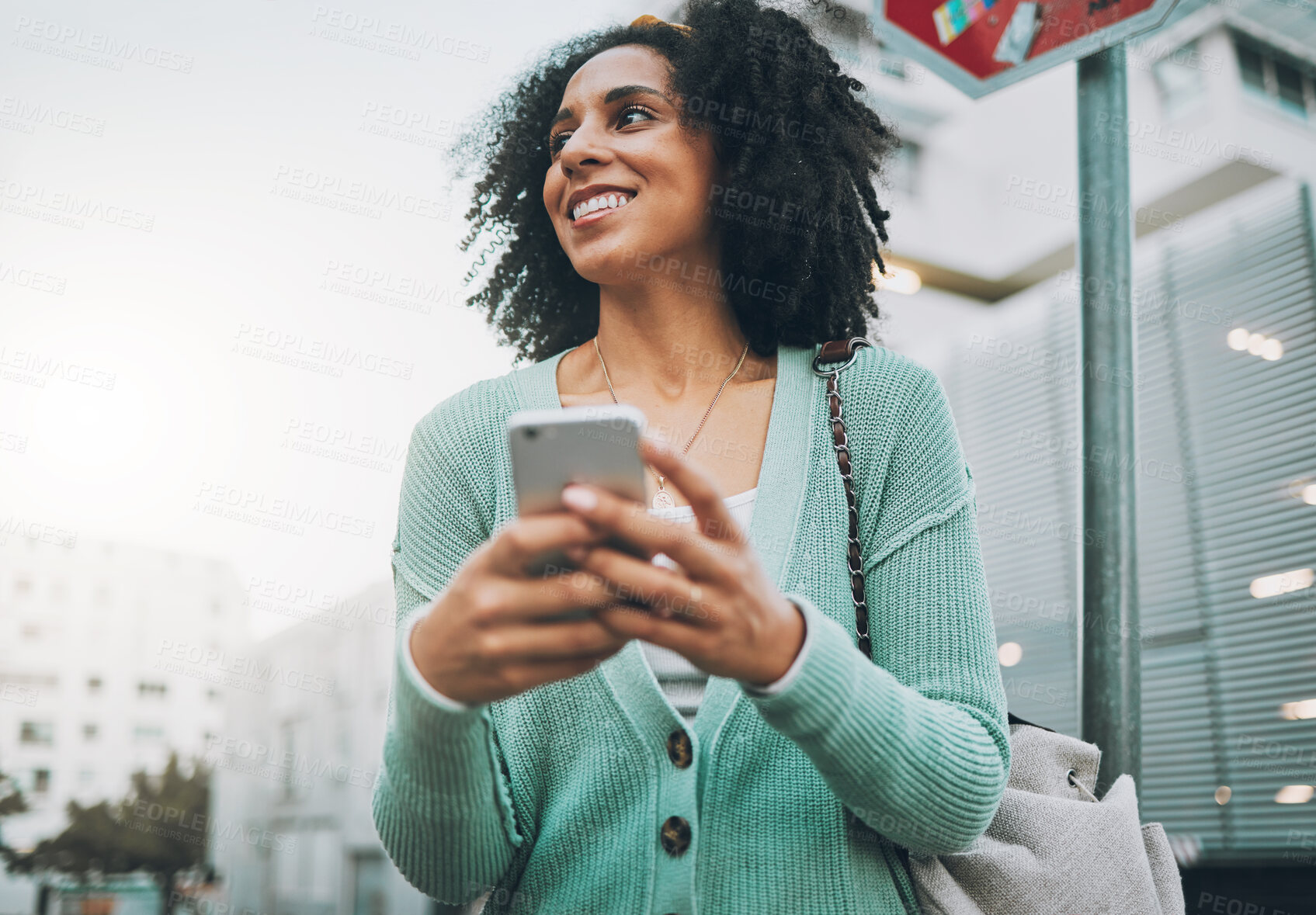 Buy stock photo Black woman, smile and phone in city, street or town for travel, walking or adventure outdoor. Woman, smartphone or urban in communication, happy or conversation on cellphone in road while traveling