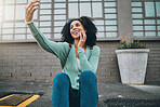 Selfie, black woman and smartphone in city, happy and smile in the outdoor, streaming live and on sidewalk. Young girl, female and phone being cheerful, trendy and edgy on pavement for happiness.