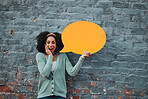 Social media, wow and woman with speech bubble against a wall in city for marketing, business and news. Portrait, happy and surprise face from girl with chat on a board and advertising communication