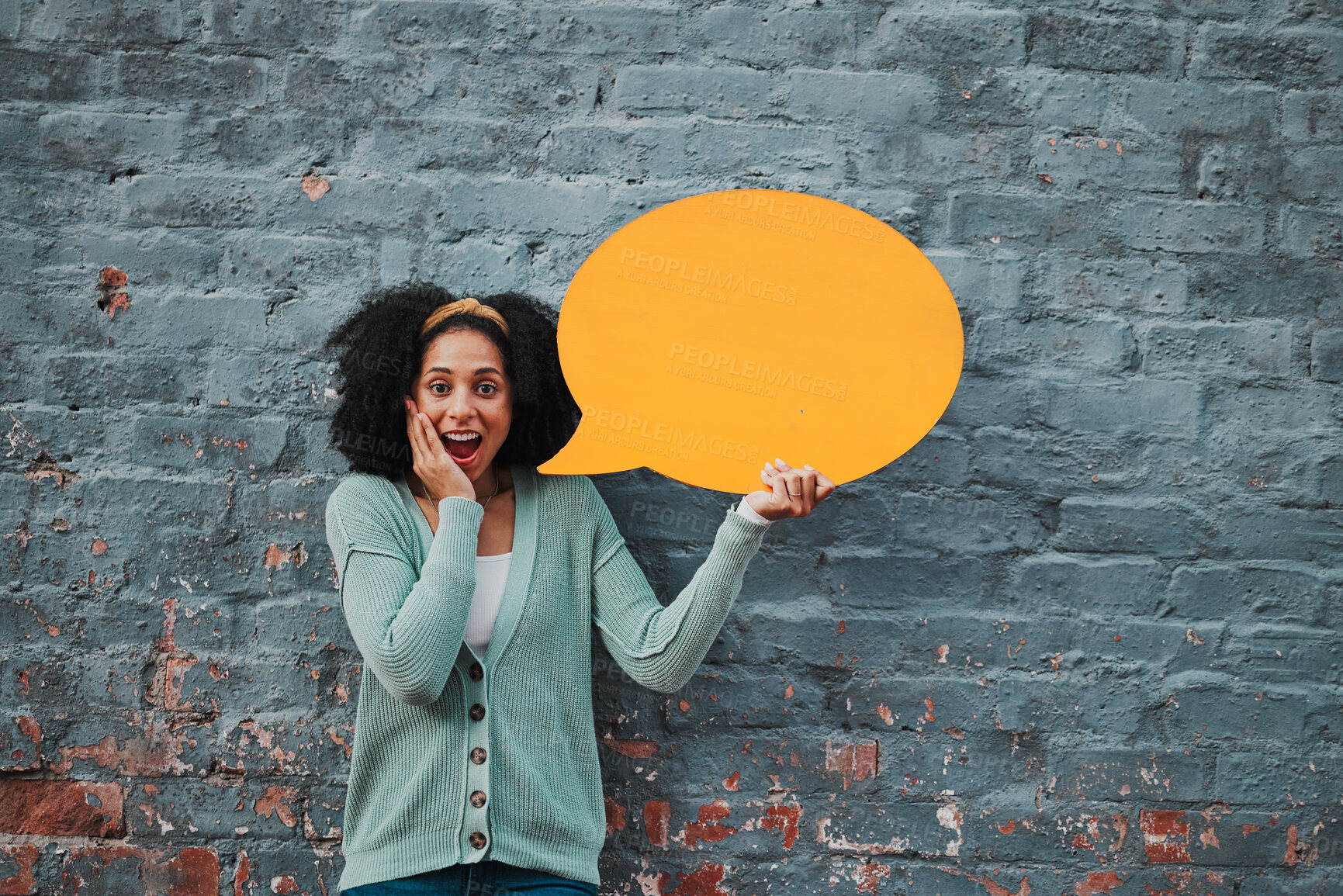 Buy stock photo Social media, wow and woman with speech bubble against a wall in city for marketing, business and news. Portrait, happy and surprise face from girl with chat on a board and advertising communication