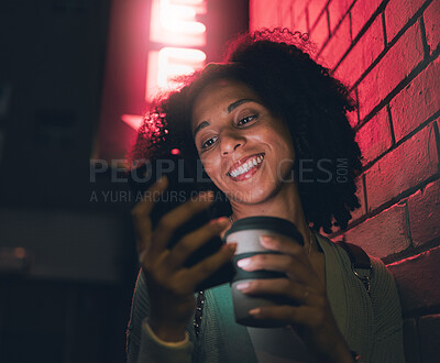 Buy stock photo Happy woman, phone and coffee in city at night by building neon lights, social media and online web location search. Young girl smile, mobile communication and 5g tech streaming on smartphone in town