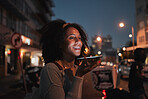 Phone, communication and travel with a woman at night in the city while talking on a call alone. Street, 5g mobile technology and conversation with a young female using a mobile while traveling