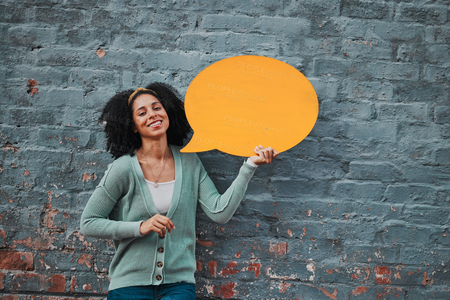 Buy stock photo Woman, portrait and brick wall with speech bubble for happy advertising, social media or opinion. Marketing, communication or brand voice of black woman with smile of joy and orange sign mockup.

