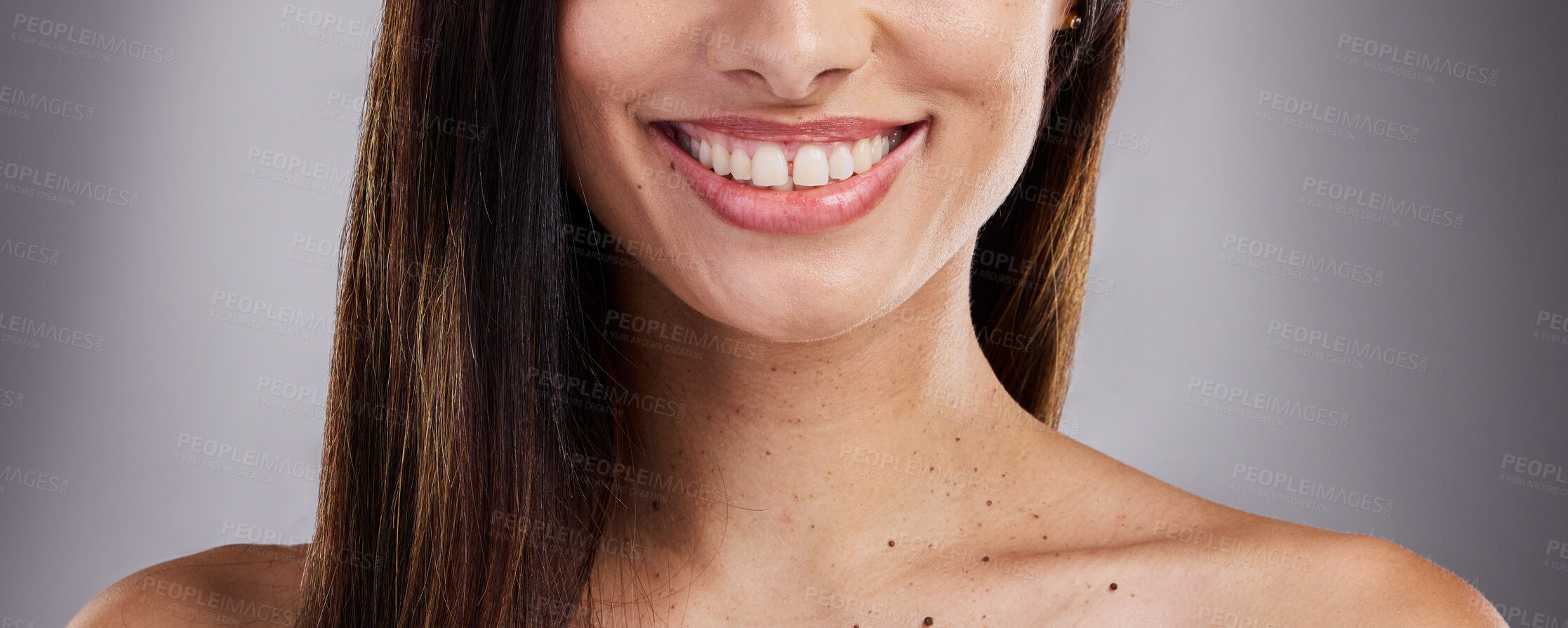 Buy stock photo Dental, care and woman with a smile for teeth, healthcare and the dentist against a grey studio background. Happy, excited and girl model with medical cosmetics for cleaning of mouth for wellness