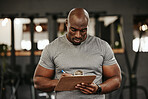 Black man, clipboard and writing in gym for training membership, sign up or subscription. Personal trainer, checklist and man from Nigeria holding paperwork to join fitness, health or wellness centre
